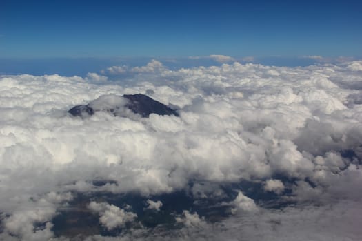 Soft clouds over view from airplane flying