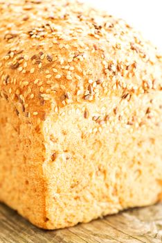 Composition with loaf of bread on wooden table