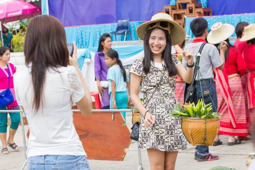 CHIANGRAI, THAILAND - AUG 12: unidentified young woman taking photograph her friend on a August 12, 2014 in Chiangrai, Thailand.