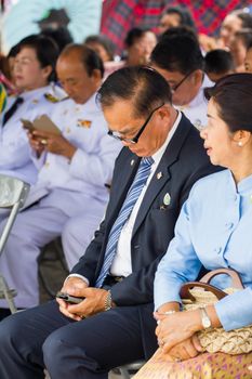 CHIANGRAI, THAILAND - AUG 12: unidentified old businessman using mobile phone on August 12, 2014 in Chiangrai, Thailand.