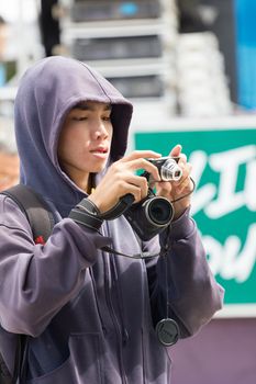 CHIANGRAI, THAILAND - AUG 12: unidentified man using camera on August 12, 2014 in Chiangrai, Thailand.