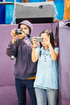 CHIANGRAI, THAILAND - AUG 12: unidentified people using camera on August 12, 2014 in Chiangrai, Thailand.
