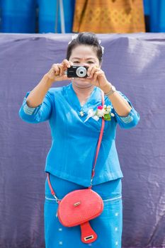 CHIANGRAI, THAILAND - AUG 12: unidentified woman using camera on August 12, 2014 in Chiangrai, Thailand.