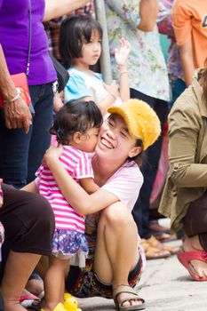 CHIANGRAI, THAILAND - AUG 12: unidentified daughter kissing her mother on August 12, 2014 in Chiangrai, Thailand.