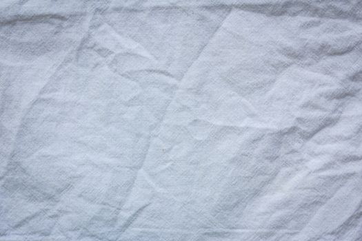 white crumpled cloth textile texture background.
