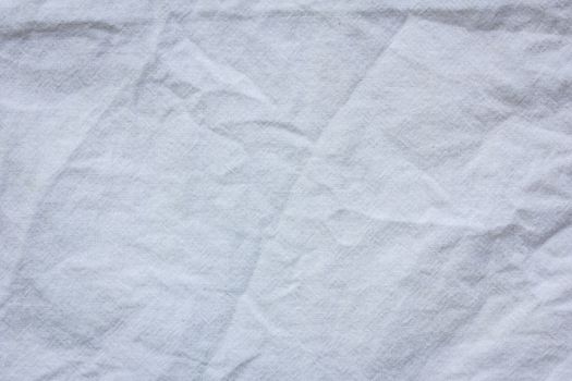 white crumpled cloth textile texture background.
