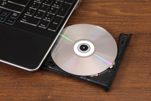 the new DVD disk cutting-in in a notebook