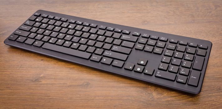 keyboard with black buttons and white letters