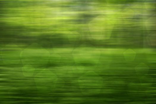 abstract green nature background, pentagon bokeh, fast motion