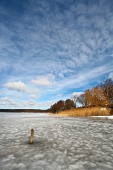 Iced lake in sun in denmark in winter