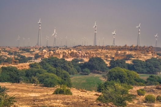 Panoramic view of wind turbines standing among bushes in Thar Desert