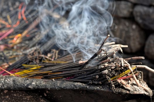 Burning aromatic incense in Nepalese buddhist temple