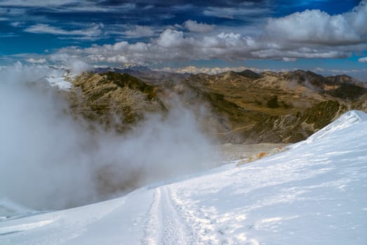 Breathtaking trail with view of Andes in high altitude near top of Huayna Potosi mountain in Bolivia