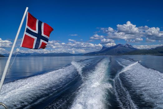 Norwegian flag on ferry to Svolvaer on Lofoten islands in Norway                