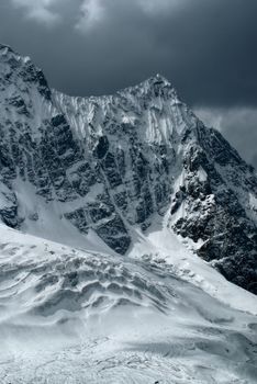 Thick clouds over majestic peaks of south american Andes in Peru, Ausangate