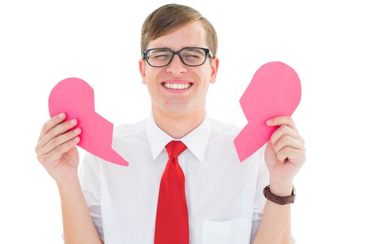 Geeky hipster holding a broken heart card on white background