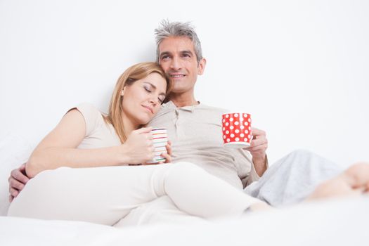 25-30, adult, apartment, attractive, bed, bedroom, caucasian, coffee, Couple, fun, handsome, happy, home, horizontal, house, leisure, lifestyle, love, marriage, men, model, nightwear, old, people, person, property, releases, sitting, smile, tea, two, women, years, young