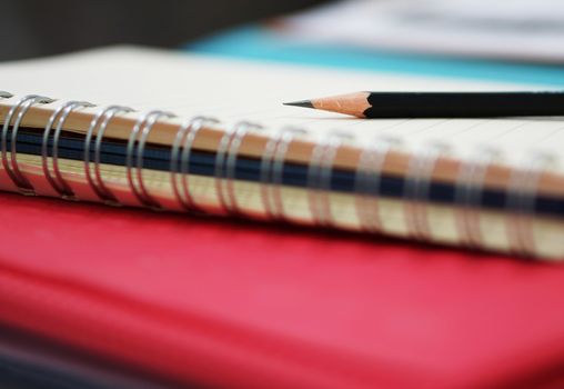 Pencil for writing down on notes memories, placed on table in office.                                