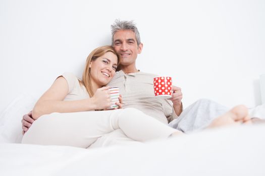 25-30, adult, apartment, attractive, bed, bedroom, caucasian, coffee, Couple, fun, handsome, happy, home, horizontal, house, leisure, lifestyle, love, marriage, men, model, nightwear, old, people, person, property, releases, sitting, smile, tea, two, women, years, young