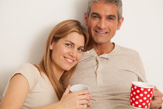 25-30, adult, apartment, attractive, bed, bedroom, caucasian, coffee, Couple, fun, handsome, happy, home, horizontal, house, leisure, lifestyle, love, marriage, men, model, nightwear, old, people, person, property, releases, sitting, smile, tea, two, women, years, young