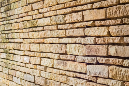 perspective of old yellow brick wall.