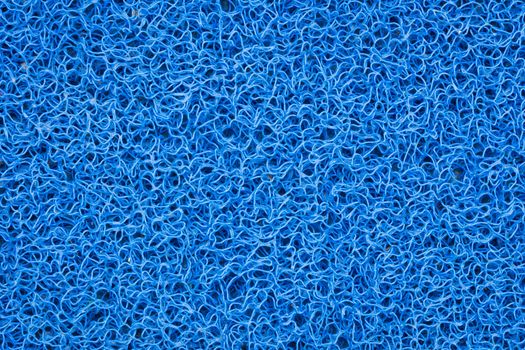 Background of green carpet or foot scraper or door mat texture.