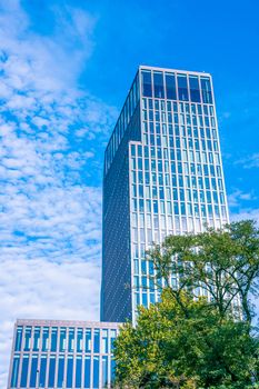 Tall building surrounded by green nature