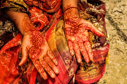 Traditional henna on brides hands on wedding in Bangladesh