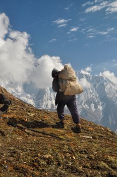 Sherpa in picturesque Himalayas mountains in Nepal