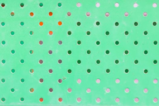 texture of dirty green metal with holes.