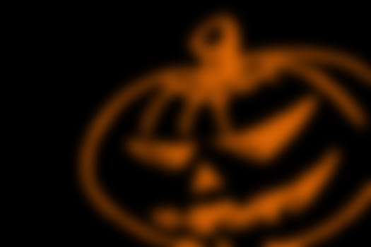 abstract black background with blurred orange line, for halloween. copyspace on the left