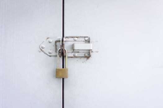 Closeup metal door with lock with copyspace on the right