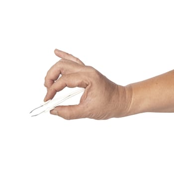 hand using a small tweezers isolated