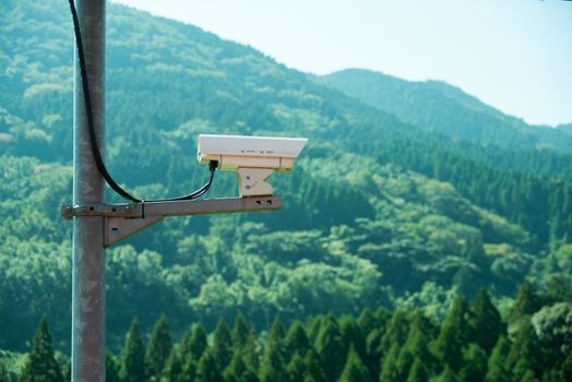 Security CCTV monitor inappropriate behavior in public area with mountain background