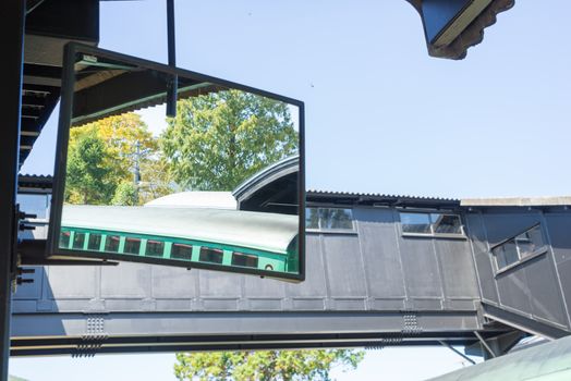 Large mirror installed on the train platform for safety to passengers and add some perspective view to the staff