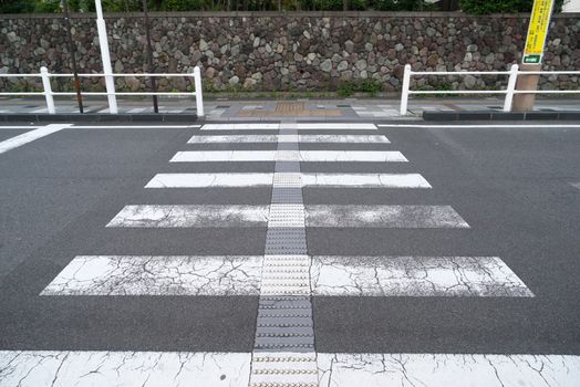 Crosswalk across the street In a point which has no barrier on the street