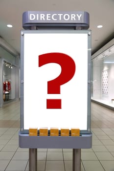 Question mark and direction sign inside shopping mall