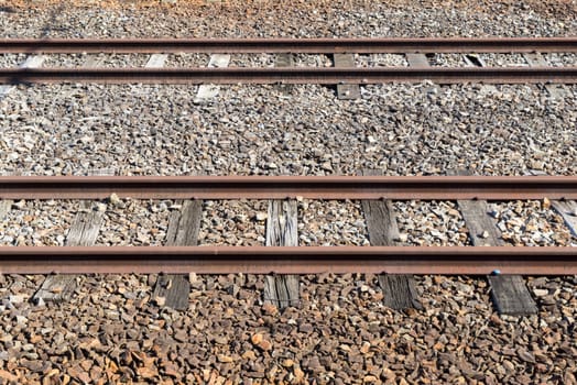 Rail of the train on many rock