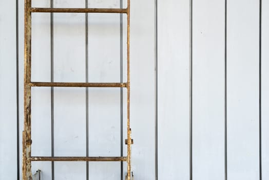 Simple old fixed ladder filled with rust