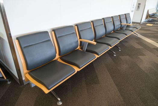 Waiting chairs for passenger before boarding at the gate of airport