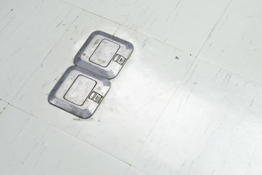 Plug Socket on the office floor that can be hidden or open up when using