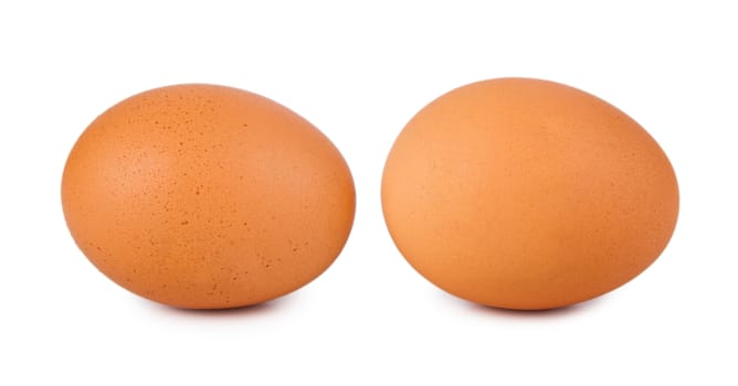 Two fresh brown eggs isolated on a white background