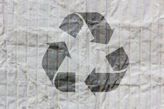 Recycle logo on old paper