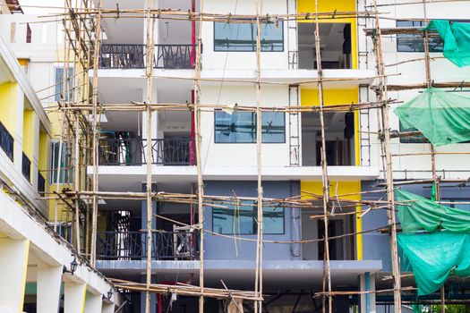 repairing old building and bamboo scaffolding.