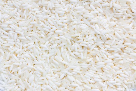 White long rice background, uncooked raw cereals, extreme macro closeup
