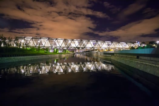 Madrid, Spain - May 5, 2012: Arganzuela Bridge illuminated on a spring night and Madrid Rio Park, Madrid, Spain