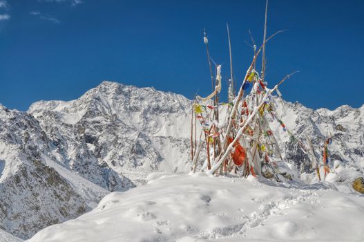 Buddhist prayer flags in Himalayas near Kanchenjunga, the third tallest mountain in the world
