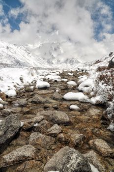 Water stream in Himalayas mountains near Kanchenjunga, the third tallest mountain in the world
