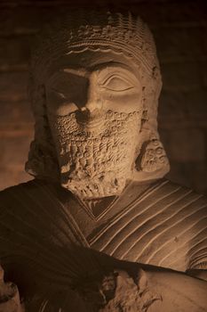Bearded smiling figure carved of stone from Turkey
