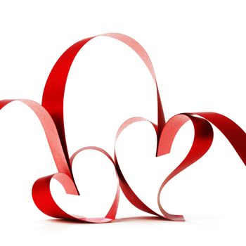 Hearts from red ribbon isolated on white background